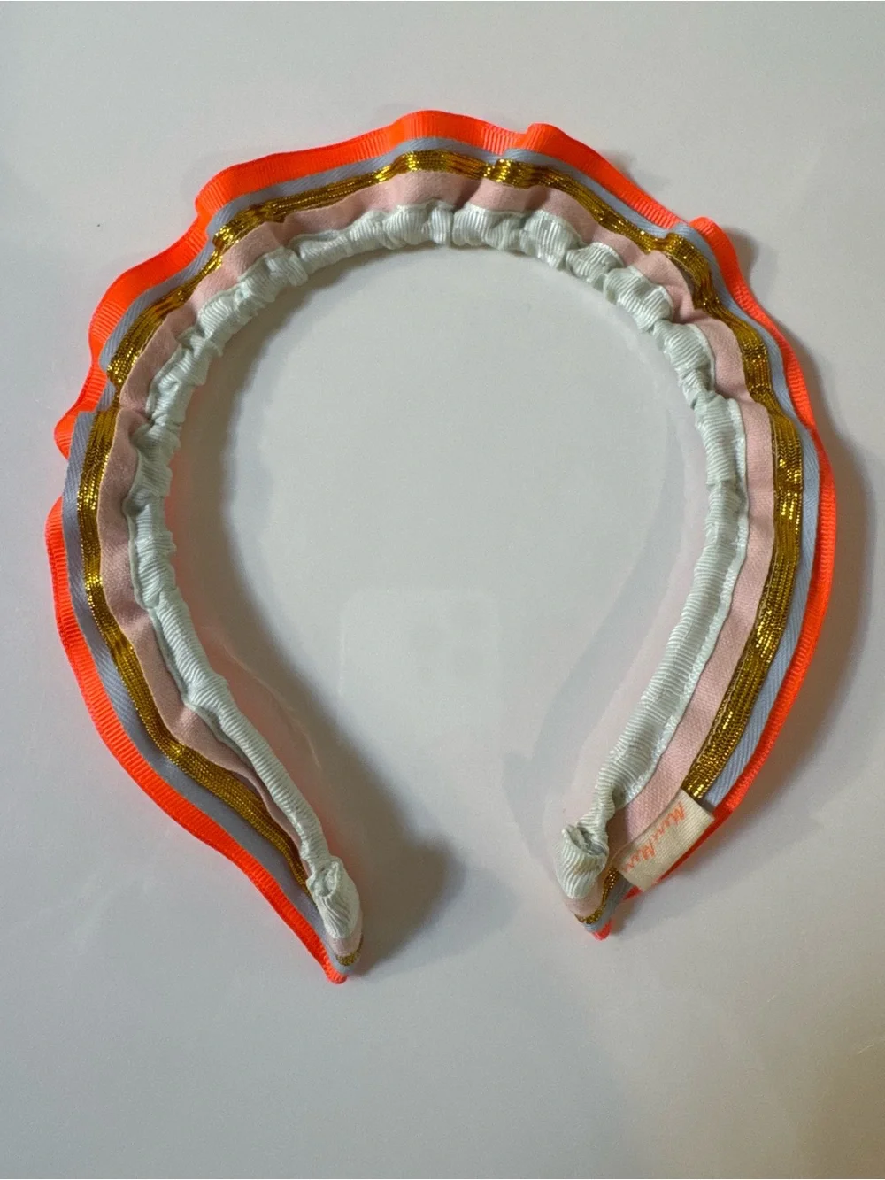 Meri Meri Neon Orange Trim Multicolor Ruffled Headband with metallic gold trim
